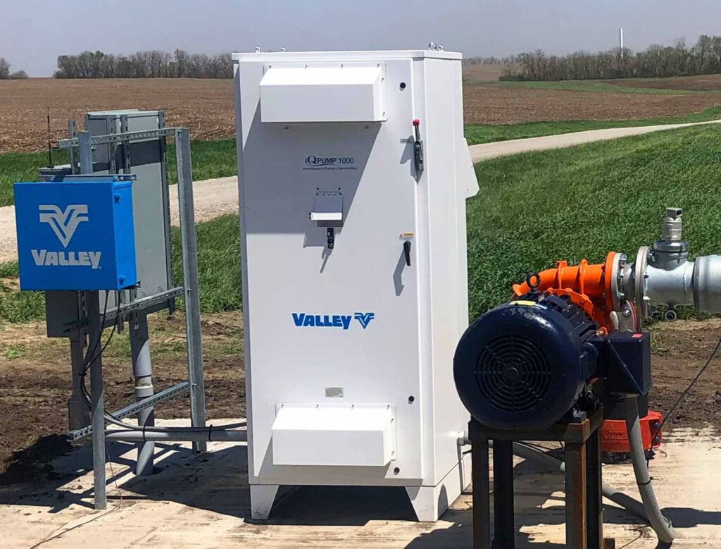 Valley brand pump command outside next to irrigation field